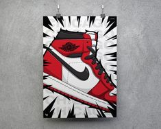 a pair of red and white sneakers hanging on a wall