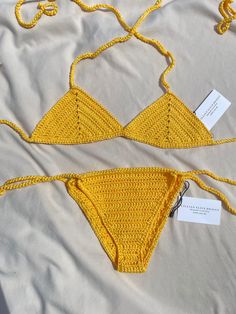 Artemisia Crochet Bikini Set Yellow Handcrafted item- each stitch is carefully designed with special attention to detail Made to order Cup Measurements (width and height): A Cup- 4x7" B Cup- 5x8" C Cup- 5x8.5" D Cup- 5.5x9" Please select clothing size XS S, M, L for bottoms Washing instructions: Hand wash with cold water, lay flat to dry Materials: 100% Mercerized Cotton Crochet Stretch Triangle Top Swimwear, Handmade Fitted Swimwear For Poolside, Stretch Crochet Swimwear For Swimming, Fitted Crochet Swimwear For Vacation, Handmade Fitted Festival Swimwear, Crochet Swimwear For Swimming, Fitted Crochet Swimwear, Fitted Crochet Swimwear For Swimming, Fitted Crochet Lace Swimwear For Beachwear