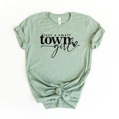 Looking for a cute versatile top to wear this summer? Make sure to grab one of our Take Me To Nashville Winged Guitar garment dyed graphic tees! This soft and comfortable graphic tee is the perfect top for any outfit. It can be paired with biker shorts, jeans, or even a simple skirt/dress! This tee is true-to-size, so be sure to order your regular t-shirt size! If you are looking for a more oversized look, make sure to size up! Simple Tshirt Design Graphic Tees, Funny Graphic Tees For Women, Cricut Tee Shirt Ideas, Retro T Shirt Designs, Trendy Tshirts Graphic Tees Design, Simple Tshirt Design, Womens Graphic Tees Vintage, Trending Graphic Tees, Western Graphic Tees