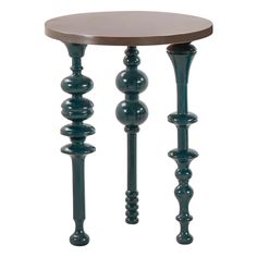 a wooden table with two metal legs and a round top on the bottom, sitting next to each other