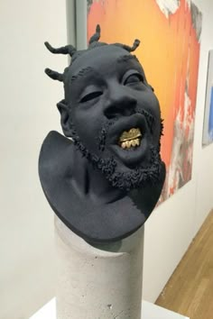 an odd looking sculpture is on display in a museum