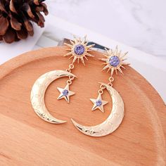 Beautiful Sun, Moon, & Star Drop Earrings. Gold With Purple Crystals. Brand New Measures Approx 2.5" Long Zinc Alloy More Photos Coming Soon! * New To Poshmark? Sign Up W/ Code Persimmon & Get A $10 Credit! Tags: Crescent Cosmic Witchy Witch Astrology Artsy Celestial Galaxy Occult Starry Beach Spring Summer Party Rave Festival Birthday Valentine's Anniversary Gift Statement Bold Big Large Unique Jewelry Trendy Maximalist Dangle Aesthetic Bohemian Boho Casual Whimsical Sparkle Punk Goth Crystal Moon, Moon And Star Earrings, Gold Moon, Moon And Star, Women Wholesale, Bohemian Earrings, Moon Star, Moon Earrings, Sun And Moon