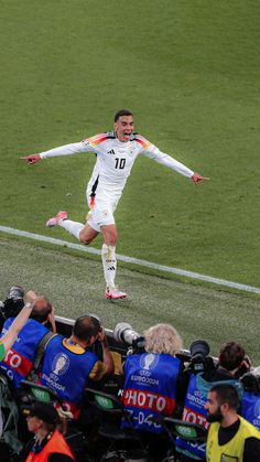 a soccer player is jumping in the air