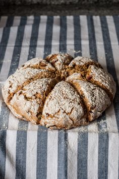 a freshly baked pastry sitting on top of a striped cloth