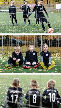 three boys are sitting on the ground playing soccer