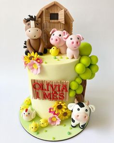 a birthday cake with farm animals on it