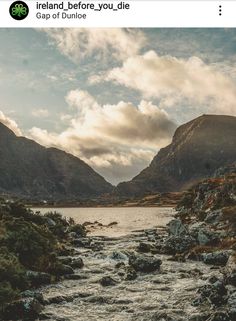 a river flowing through a lush green valley