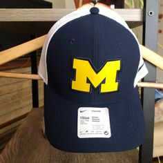 Brand New With Tags Nike Trucker Hat Adjustable Navy And White, With Maize Block M Nike Casual Trucker Hat For Sports, Nike Casual Sports Trucker Hat, Casual Blue Hat For Game Day, Collegiate Navy Baseball Cap, Navy Collegiate Baseball Cap, Navy Fan Gear Cap, Collegiate Navy Cap, Navy Collegiate Cap, Navy Cap For Fan Gear