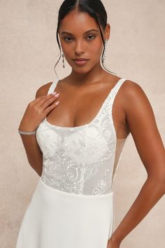 Everything will feel instantly perfect the moment you step into the Lulus Positively Romantic White Sheer Mesh Embroidered Maxi Dress on your big day! Intricate embroidery and shiny clear sequins adorn sheer mesh fabric as it shapes a seamed bodice with padded, lined cups, a scoop neckline, a low-cut back, and slender tank straps. The high, fitted waist tops a crepe knit A-line skirt that cascades down to a sweeping maxi hem with a lovely train at the back. Hidden back zipper/clasp. Fit: This ga Lace Dress With Sheer Back And Fitted Bodice, Wedding Dress With Sheer Back And Sweetheart Neckline, Fitted Dress With Sheer Back For Wedding Night, Fitted Bridesmaid Gown With Illusion Neckline, Fitted Lace Gown With Sheer Back, Fitted Lace Wedding Dress With Illusion Neckline, Wedding Dress With Sheer Bodice And Heart-shaped Neckline, Embroidered Sweetheart Neckline Wedding Dress, Embroidered Wedding Dress With Sweetheart Neckline