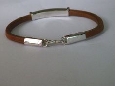 handcrafted  natural leather bracelet. Manually shaped natural brown leather with silver elements and hook clasp.It's a very strong and long lasting  natural leather bracelet, stamped .925 sterling silver.Length of the bracelet-Up to  22.80 cm/9 inches/Width of the bracelet-7.79 mm/0.30inches/Length of the silver element - 43.00 mm/1.69 inches/Height of the silver element-6.83 mm/0.27 inches/Length of the end caps+hook clasp-44.56mm(1.75 inches)Pick   your size and color:Length:  6inches ,6,5inc Leather Bracelet With Palladium Hardware As Gift, Brown Leather Bracelet With Palladium Hardware, Silver Rectangular Leather Bracelet For Everyday, Rectangular Silver Leather Bracelet For Everyday, Everyday Silver Rectangular Leather Bracelet, Adjustable Leather Bracelet With Palladium Hardware As Gift, Everyday Engraved Brown Leather Bracelet, Everyday Brown Engraved Leather Bracelet, Silver Leather Bracelet With Lobster Clasp For Everyday