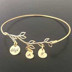 "Please mention the initials you want in \"notes\" box during checkout or message initials to me if notes box does not appear. Personalize this family tree bracelet for mom with kids initials. I can also fit Nana, Gigi,or Nona on the circle charm and put grandkid's initials on the heart charms. Makes a great gift for mom or nana. I can also do a \"couple stamping\" such as D&B or K+J. See the 2nd picture. I can fit a couple stamping on a circle charm or a heart charm. But I cannot fit 3 or 4 Personalized Mom Jewelry, Mom With Kids, Christmas Gift Mom, Bracelet For Mom, Mom Jewelry Personalized, Custom Charm Bracelet, Unique Mothers Day Gifts, Moms Bracelet, Custom Charms