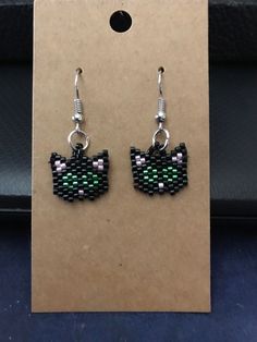 Black cat with green eyes earrings handmade in the USA Handmade Black Casual Earrings, Handmade Casual Black Earrings, Cat Beaded Earrings, Wire Cat Earrings, Beaded Cat Earrings, Beaded Black Cat Earrings, Black Cat With Green Eyes, Cat With Green Eyes, Cute Black Cat Earrings