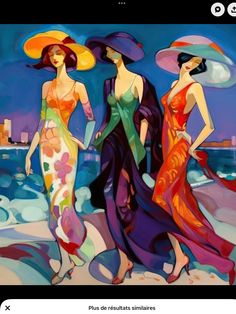 two women in colorful dresses and hats walking on the beach with buildings in the background