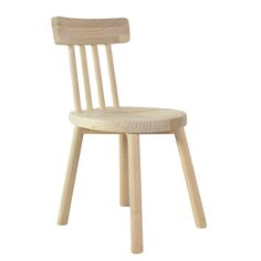 a wooden chair sitting on top of a white floor