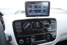 a car dashboard with an electronic device in the center