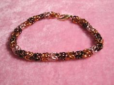 This is a Byzantine bracelet. The colors are a neutrals (gold, bronze, and rose tone). Closure is a lobster clasp. Byzantine Bracelet, Rose Tone, Feb 8, Jump Rings, Lobster Clasp, Jewelry Bracelets, Etsy Uk, Bracelet, Gold