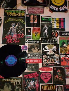 a wall covered in various records and stickers