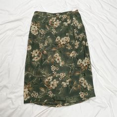 Vintage 1990s midi/maxi green and cream flower skirt. In good condition. Note: I try to match colors as much as possible to pictures but there is a possibility it won't be an exact match. Unless the color is completely incorrect I am unable to offer refunds for this reason. Size: 18W Brand is Amanda Smith II Measurements (taken on garment laid flat): Waist: 39" Hips: 53" Length: 34.5" Fabric: 100% polyester Vintage Green Long Skirt, Green Vintage Long Skirt, Vintage Long Green Skirt, Vintage Green Summer Skirt, Vintage Green Skirt For Summer, Vintage Green Skirt For Spring, Maxi Skirt 90s, Fashion Definition, Floral Silk Skirt