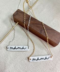 The perfect minimalistic mama necklace to wear on the day to day! This necklace looks great layered with other necklaces & you have the option to choose from a silver or gold chain. Chains are gold or silver plated over steel then finished off with a lobster clasp closure. Mama pendants are handmade from stoneware clay then imprinted & kiln fired. The cutest gift for mom! -Chain Length: 15inches (approximate)  -Ceramic Pendant Size: 1 3/4inch (approximate) -Hypoallergenic: all earrings findings or necklace chains are made with nickel-free metals such as stainless steel, gold-plated or silver-plated -Comfort: the jewelry findings are made with hypoallergenic materials making them comfortable for sensitive ears & everyday, all-day wear. In addition, the clay is rolled into a thin slab before White Charm Necklace For Mother's Day Gift, White Charm Necklaces For Mother's Day Gift, Minimalist Hand Stamped Jewelry For Mother's Day, Meaningful White Jewelry For Mother's Day, Minimalist Nickel-free Necklaces For Mother's Day, Minimalist Nickel-free Necklace For Mother's Day, White Charm Necklace With Adjustable Chain For Mother's Day, Minimalist Hypoallergenic Necklace For Mother's Day, Minimalist Personalized Necklace For Everyday Use