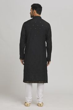 Black silk blend kurta with sequins and thread embroidery. Comes with churidar and a dupatta. - Aza Fashions Black Chikankari Chanderi Sherwani, Black Chanderi Sherwani For Navratri, Black Cotton Sets With Mirror Work, Transitional Black Kurta With Mirror Work, Black Embroidered Cotton Sherwani, Designer Black Cotton Churidar, Black Cotton Churidar With Zari Work, Black Chanderi Kurta With Chikankari Embroidery, Black Chikankari Chanderi Kurta