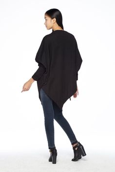 "🚚..ALL ORDERS ARE SHIPPED VIA DHL EXPRESS MAIL This batwing tunic is a very \"cool\" addition to any wardrobe! With a unique drawstrings on bottom hem of tunic provide plenty of options for changing the look. Cowl neckline, batwing sleeves with wide cuffed and oversized side pocket; can be worn layered over leggings, pants, or skirt for even more dramatic effects. * Pull-on style * Cowl neckline * Dropped shoulders * Long sleeves with wide ribbed cuff * Oversize side pocket * Asymmetrical hem Winter Plain Top With Asymmetrical Hem, Long Sleeve Cape For Fall Workwear, Casual Long Sleeve Cape For Layering, Versatile Fall Poncho, Asymmetrical Sweater For Winter, Solid Poncho For Winter Layering, Winter Solid Outerwear With Batwing Sleeves, Oversized Long Sleeve Chic Cape, Chic Long Sleeve Cape For Fall