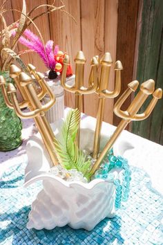 a gold candelabra sitting on top of a table