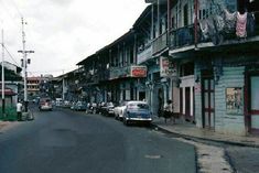 an old car is parked on the street