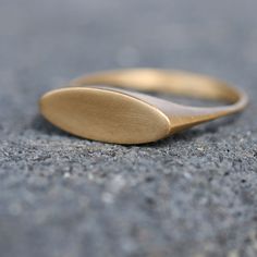 Elevate your jewelry collection with this stunning 14k solid gold oval signet ring, available in a variety of metal options including rose gold and 18k. The dainty design adds a touch of elegance to any outfit, making it the perfect accessory for both casual and formal occasions. This custom ring is a timeless piece that can be passed down for generations, and the option to engrave on it makes it even more special. Whether you're looking for a unique gift for a loved one or a signet ring women can wear with pride, this piece is sure to impress. The simplicity of the design also makes it a versatile piece that can be dressed up or down depending on the occasion. Invest in a piece of jewelry that will last a lifetime and make a statement with this exquisite gold signet ring. A special ring t Signet Ring Women, Gold Butterfly Ring, Oval Signet Ring, Signet Rings Women, Solid Gold Band, Signet Rings, Special Ring, Gold Signet Ring, Custom Ring