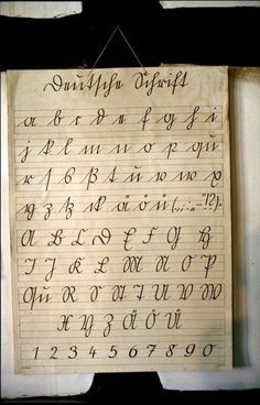 an old manuscript written in cursive writing on paper with numbers and letters attached to it