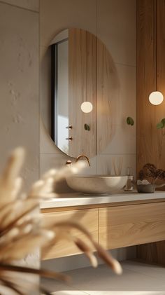 a bathroom with a sink, mirror and plants on the counter top in front of it