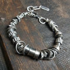 "Handmade oxidized sterling silver bracelet - for men and women. The bracelet is made of silver 925.  It is available with either raw or polished finish. We offer bracelets in many sizes of the wrist circumference: 6\" (15 cm), 6.5\" (16,5 cm), 7\" (18 cm), 7.5\" (19 cm), 8\" (20,5 cm), 8.5\" (21.5 cm), 9\" (23 cm).  Choose the one that is most similar for your wrist circumference and share your actual wrist circumference in the note to your order. This way we can perfectly adjust the size of your bracelet. We send jewelry in an elegant box. Thanks for visiting Treendystudio!" Luxury Bohemian Oxidized Sterling Silver Bracelet, Luxury Adjustable Hand-tooled Jewelry, Luxury Artisan Sterling Silver Bracelet With Oxidized Finish, Luxury Everyday Oxidized Finish Bracelets, Luxury Hand Forged Adjustable Sterling Silver Bracelet, Luxury Bohemian Sterling Silver Bracelet With Oxidized Finish, Rustic Silver Bracelets, Luxury Sterling Silver Bracelet With Oxidized Finish, Luxury Collectible Oxidized Sterling Silver Bracelet