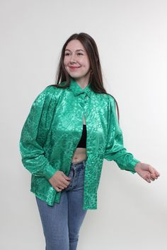 Hi! This is vintage from 80s floral blouse in green color with long sleeves. This vintage bow sleeve green blouse made of POLYESTER. Model on the photo is 170 cm tall and is wearing a LARGE size printed retro blouse. ( 40 - size on the tag). But, be careful, this is a vintage size, it is better to check the measurements below in the product description. Sleeves - 49cm/ 19.29inch; Width - 53cm / 20.86inch;  Length - 72cm / 28.34inch. All measurements are taken seam to seam while lying flat. Addit Green Floral Print Long Sleeve Shirt, Green Long Sleeve Party Blouse, Green Long Sleeve Blouse With Floral Print, Vintage Floral Print Party Blouse, Green Tops With Vintage Print, Green Retro Tops With Vintage Print, Green Vintage Print Top For Spring, Vintage Green Tops For Fall, Retro Green Tops With Floral Print