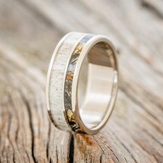 a wedding ring with antler wood inlays