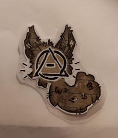 a sticker depicting an animal with the letter a on it's face and another bear behind it