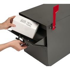 a person is opening a mailbox with a red handle and paper sticking out of it