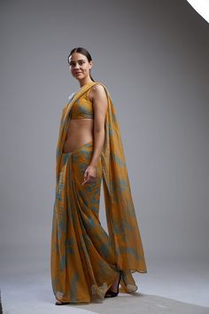 Editor's Note Featuring a yellow and blue floral saree with blouse. Color: Yellow; Blue Fabric: Chanderi Silk Care: Dry Clean Only About the Designer KoAi means "Love Child" Non-fussy clothes for everyday wear. These pieces can be worn at any time of the day.i.e for work, brunch, evening wear, by the pool. Basically everywhere. Yellow Blouse Piece With Sheer Dupatta, Yellow Georgette Blouse With Traditional Drape, Yellow Saree Blouse Piece For Navratri, Navratri Yellow Saree Blouse Piece, Yellow Blouse With Traditional Drape, Unstitched Yellow Sets With Kalamkari Print, Unstitched Yellow Kalamkari Print Sets, Yellow Kalamkari Print Sets, Anarkali Kalamkari Pre-draped Saree