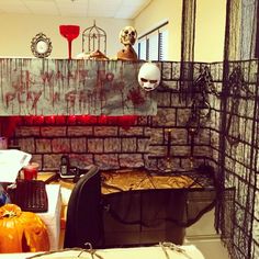 a room decorated for halloween with pumpkins and decorations on the walls, including a skeleton head