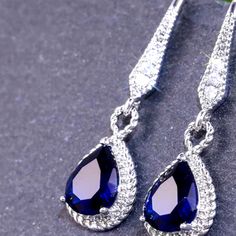 Sterling Silver Dark Blue Cz Water Drop Earrings Sapphire Crystal Teardrop Earrings, Elegant Blue Crystal Teardrop Earrings, Elegant Sapphire Crystal Dangle Earrings, Blue Sterling Silver Earrings For Evening, Sapphire Crystal Drop Earrings, Blue Cubic Zirconia Crystal Earrings, Sapphire Drop Earrings For Party, Elegant Blue Drop Crystal Earrings, Blue Sterling Silver Crystal Earrings For Formal Events