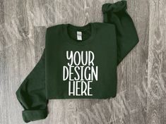 showcase your sweatshirt designs with our folded forest green Gildan 18000 model mockup photo!   ✨Details✨ This is a digital download ONLY This image is for the Gildan 18000 Sweatshirt ✨Download Includes✨ 1 high-resolution JPG free of watermark and branding. ✨Notes✨ THIS IS A DIGITAL PRODUCT, NO physical item will be delivered Once the payment is cleared through Etsy you will receive an email with the download link. You can also download it from the Profile Purchases via Etsy. ✨Terms of Use ✨ THE FOLLOWING PERMISSIONS ARE HEREBY GRANTED TO THE LICENSEE: - You may place your graphic or logo onto the image. - You may crop or rotate the image as needed. - Personal and commercial use is permitted. THE FOLLOWING ACTIONS ARE STRICTLY PROHIBITED - You do not have permission to resell this image. Green Cotton Sweatshirt With Custom Print, Customizable Green Long Sleeve Sweatshirt, Customizable Long Sleeve Green Sweatshirt, Customizable Green Long Sleeve T-shirt, Customizable Long Sleeve Green T-shirt, Green Branding Sweatshirt For Fall, Green Branded Sweatshirt For Fall, Green Sweatshirt With Branding For Fall, Sweater Mockup