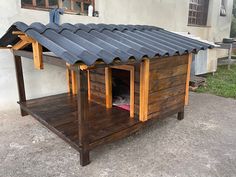 a dog house made out of wood and metal