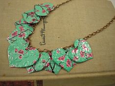 a necklace with flowers on it is shown in an article about how to wear it