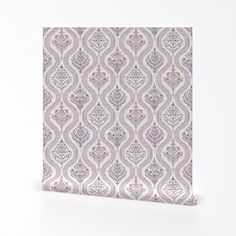 a purple and white wallpaper with an intricate design on it's side, in front of a white background