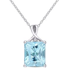 Classic beauty encompasses this beautiful emerald-cut blue & white topaz pendant. In sterling silver, one round white topaz and one emerald-cut blue topaz radiate awareness and wisdom. This pair is perfect for December birthstone gifting or accessorizing for any occasion. | Emerald-cut Blue & White Topaz Pendant Necklace | Sterling Silver | Size 18" | Helzberg Diamonds Helzberg Diamonds, Topaz Pendant, Pendant With Chain, Sky Blue Topaz, Birthstone Gifts, Topaz Stone, Solitaire Pendant, Topaz Gemstone, Drop Necklace