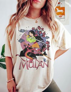 Vintage Mulan 1998 Shirt Pop Culture Screen Print Crew Neck Shirt, Pop Culture Crew Neck Shirt With Screen Print, Pop Culture T-shirt With Character Print And Relaxed Fit, Pop Culture Fan Merchandise Crew Neck Shirt, Summer Crew Neck Shirt With Character Print, 90s Style Fan Merchandise Shirt For Summer, 90s Crew Neck Top With Character Print, Relaxed Fit Crew Neck T-shirt With Character Print, 90s Style Crew Neck T-shirt With Character Print