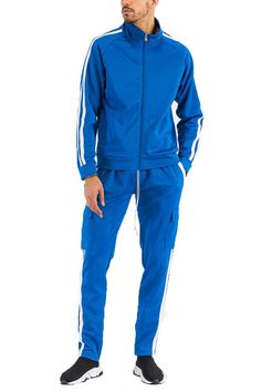 Regular Fit  Full Zip Jacket  Two Stripe Design on Sleeve  Velcro Closure Cargo Pouch  95 Polyester 5 Spandex Athleisure Outdoor Tracksuit With Pockets, Athleisure Tracksuit With Pockets For Outdoor, Sporty Stretch Track Jacket With Pockets, Functional Blue Track Jacket With Pockets, Sporty Long Sleeve Tracksuit With Pockets, Stretch Tracksuit With Pockets For Sports, Stretch Sports Tracksuit With Pockets, Fall Sports Tracksuit With Pockets, Fitted Athleisure Tracksuit With Pockets