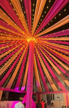 the inside of a tent decorated with lights