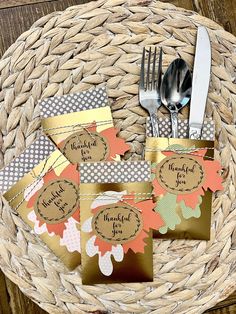 place cards and silverware in a woven basket