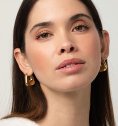 Meet these gorgeous hoop earrings. They're not just lightweight, tarnish-resistant, and waterproof, but also super chic! The puffy design gives them a modern and sleek look, perfect for any occasion. Trendy Teardrop Hoop Earrings, Modern Hoop Earrings For Everyday, Sleek Metal Earrings For Everyday Wear, Sleek Everyday Metal Earrings, Modern Small Hoop Earrings Tarnish Resistant, Modern Metal Hoop Earrings, Modern Tarnish Resistant Small Hoop Earrings, Trendy Gold Earrings For Work, Sleek Tarnish-resistant Earrings