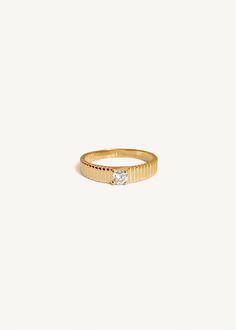 Inspired by Jennie's mother, Sun's vintage pleated ring, the Solis collection represents energy and strength. As an immigrant from South Korea in the 90's, Sun wore her ring as a reminder that she could make it through anything she set her mind to.Whether you're celebrating a commitment to a partner or a modern milestone, the Solis II is a timeless piece that you'll never take off.This ring is the smaller version of the Solis Ribbed Ring II.To add a custom engraving on the inside of the band, vi Diamond Ring With Fluted Bezel, Diamond Ring With Fluted Bezel And Round Cut, Diamond Rings With Fluted Bezel For Wedding, Elegant Diamond Ring With Fluted Bezel For Anniversary, Wedding Diamond Ring With Fluted Bezel, Fine Jewelry Wedding Rings With Fluted Bezel, Timeless Diamond Ring With Fluted Bezel, Wedding Rings With Fluted Bezel, Classic Rings With Fluted Bezel