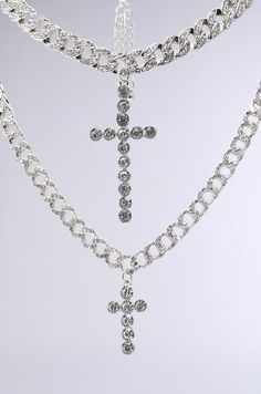 Double the drip. The AKIRA Label Iced Out Necklace Set contains a set of two rhinestone-embellished cuban chain links of varying lengths and width. The shorter chain features a wider design, with a large dangling cross pendant made of circular gemstones, while the longer chain has a thin silhouette and features a smaller, coordinating cross pendant. Stack together or wear separately for a look icier than Elsa herself. - 100% Man-Made Materials (all measurements approximate from size O/S)- 16”, 23” Circumference- 2.5”, 1.25” Pendant Length- Imported Product ID: 347756 All White Party, Cold Weather Boots, White Accessories, Chunky Heels Boots, Wide Calf Boots, Chain Links, How To Stretch Boots, Cuban Chain, Calf Boots